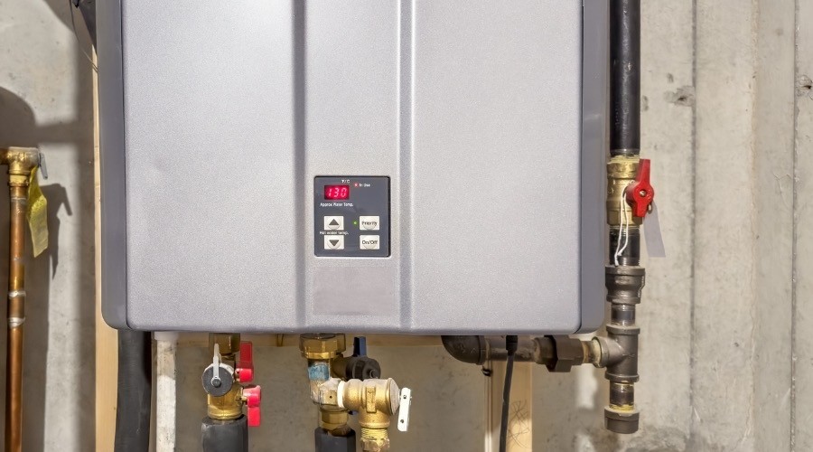 Modern tankless water heater installation and efficient on-demand hot water system.